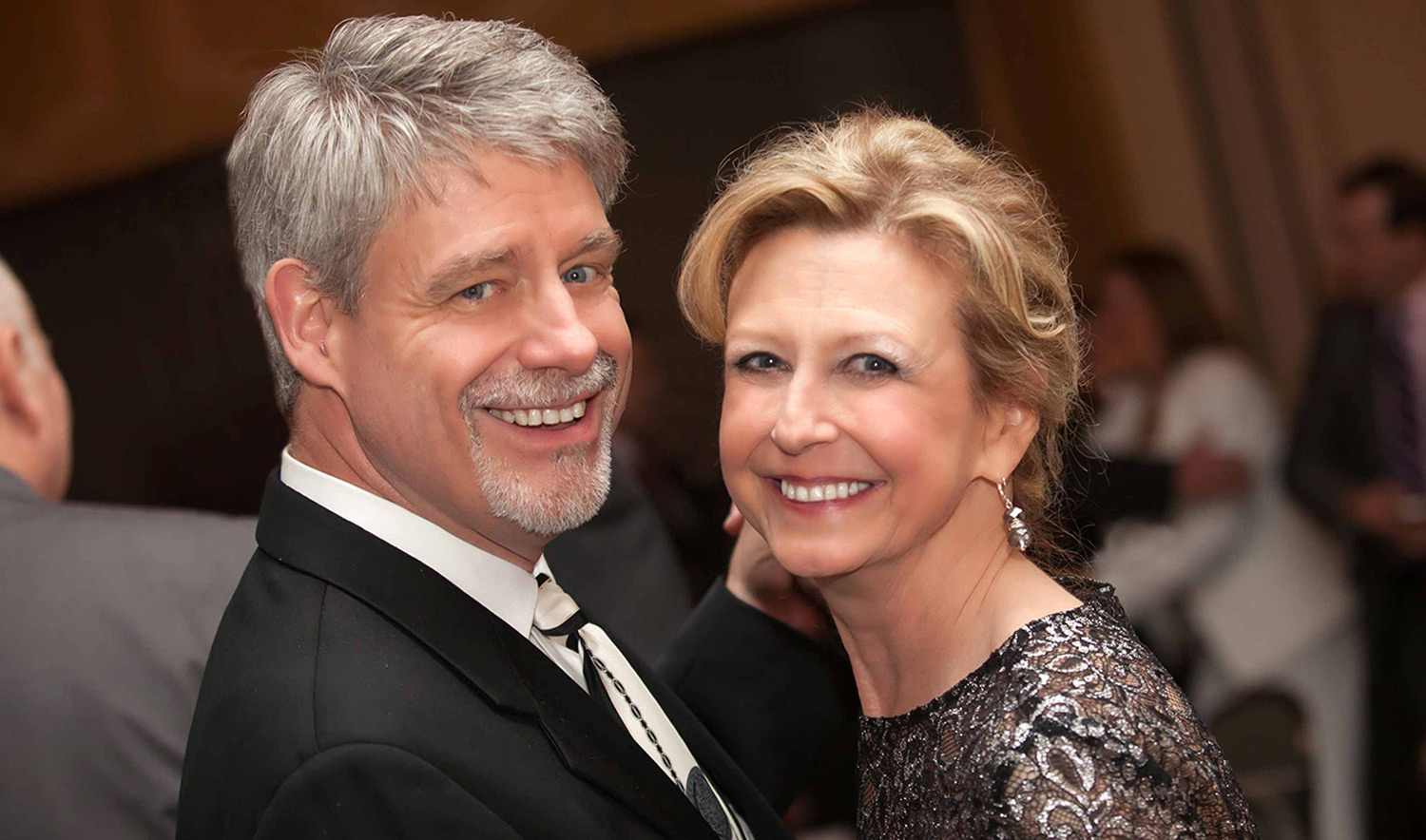 A portrait of Bill and Debra Brown at a formal event.